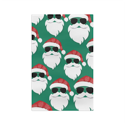 Cool Santa Aloha Kalikimaka kitchen towel with sunglasses Santa, tropical greenery and Christmas ornaments