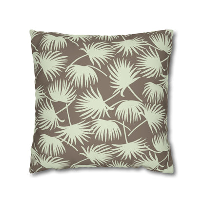 A square throw pillow featuring a repeating palm leaf pattern in sage green on a warm taupe-brown background, shown against a plain white studio background.