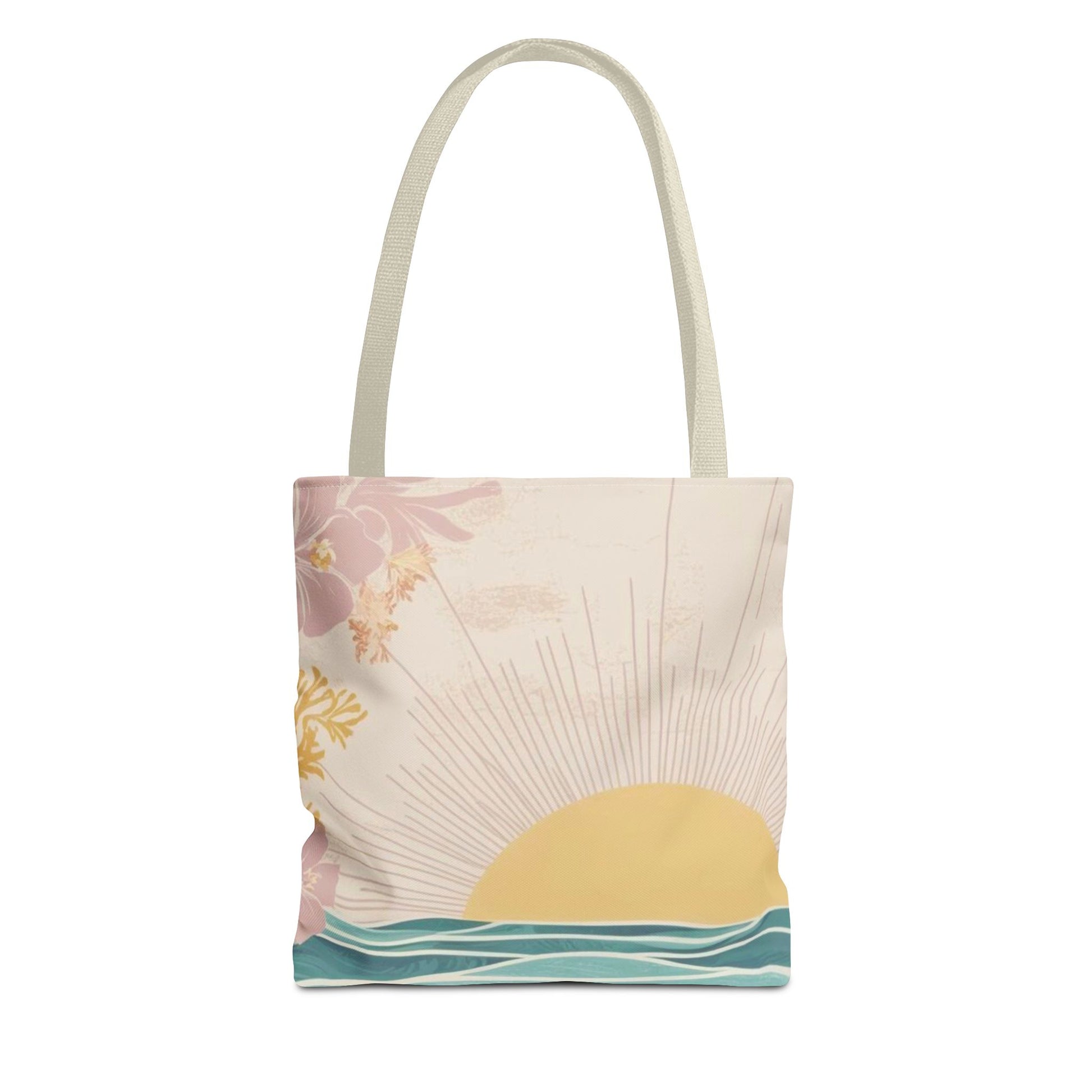A canvas tote bag with a retro-style tropical sunset print, featuring a yellow sun, pink flowers, and teal ocean waves on a cream background, with light beige shoulder straps.