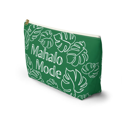 A green zippered pouch with a white tropical monstera leaf pattern and the words 'Mahalo Mode' printed on the front, shown on a clean white background.