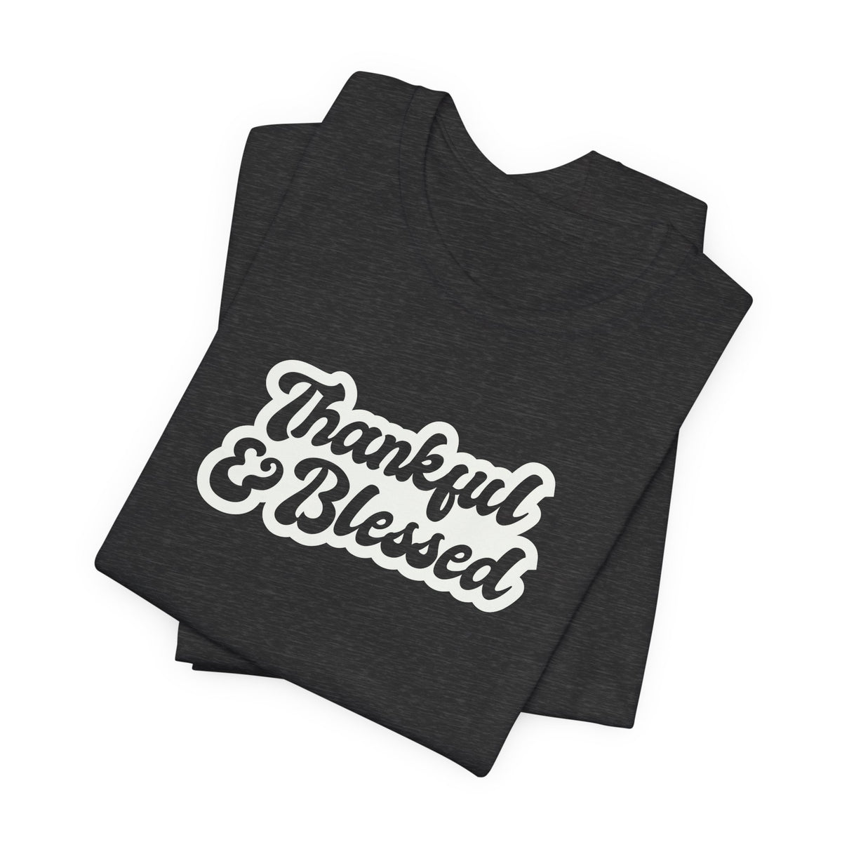 A folded black t-shirt with 'Thankful & Blessed' printed in a white and brown retro-style font, displayed on a clean white background.