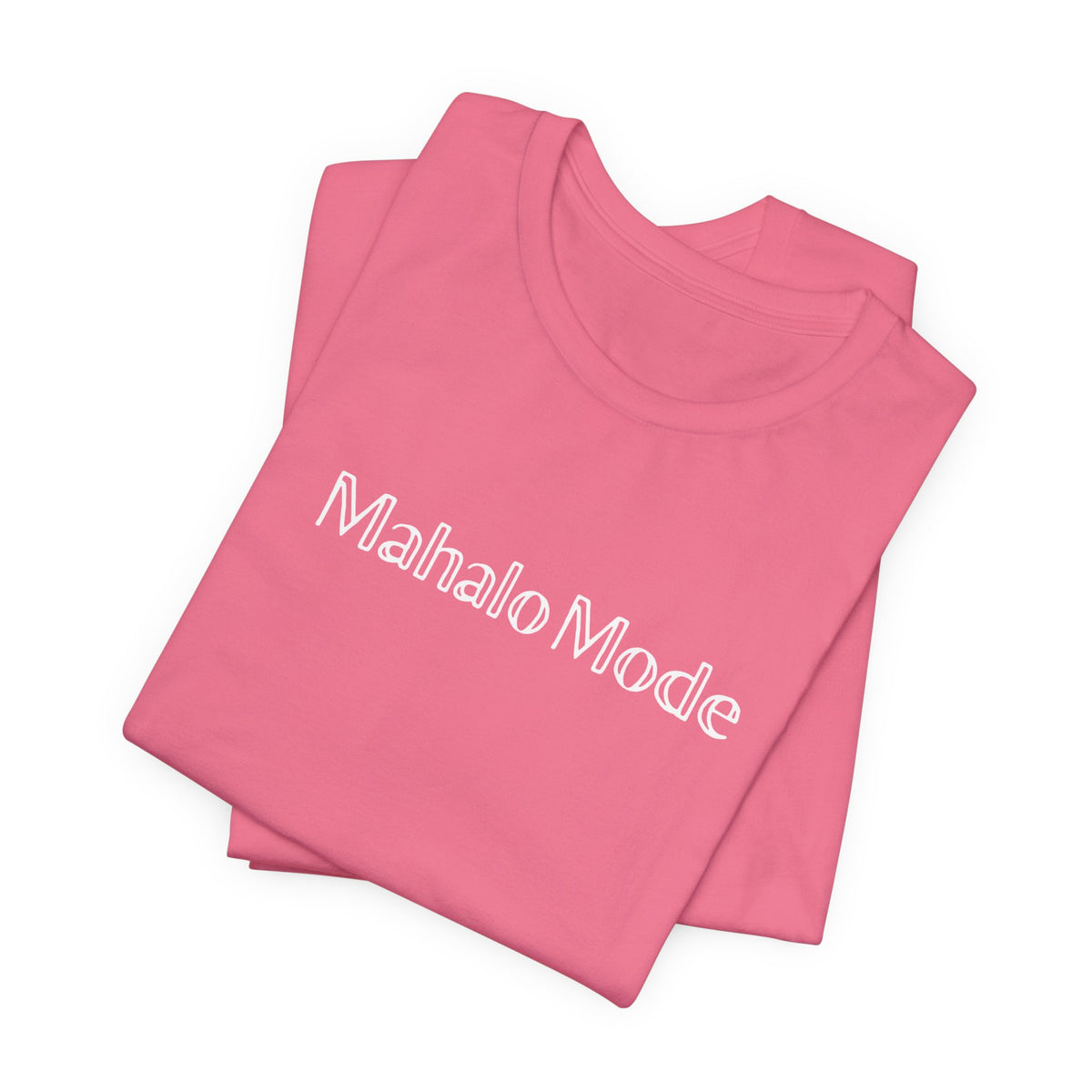 A folded Mahalo Mode graphic tee in charity pink with white outlined lettering, Global Village Kailua original design.