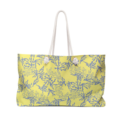 A yellow tote bag with a ocean coral pattern and white rope handles, shown against a plain white background.