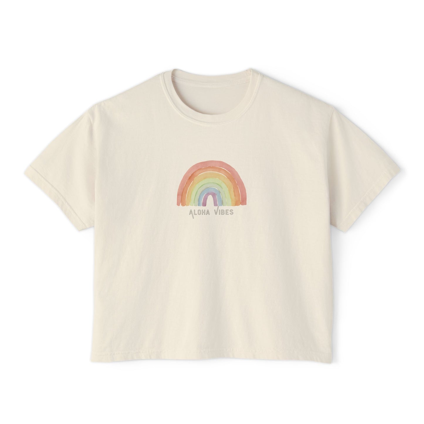 An off-white short-sleeve crop top t-shirt featuring a pastel rainbow graphic on the chest with the text 'ALOHA VIBES' underneath, displayed on a clean white background.