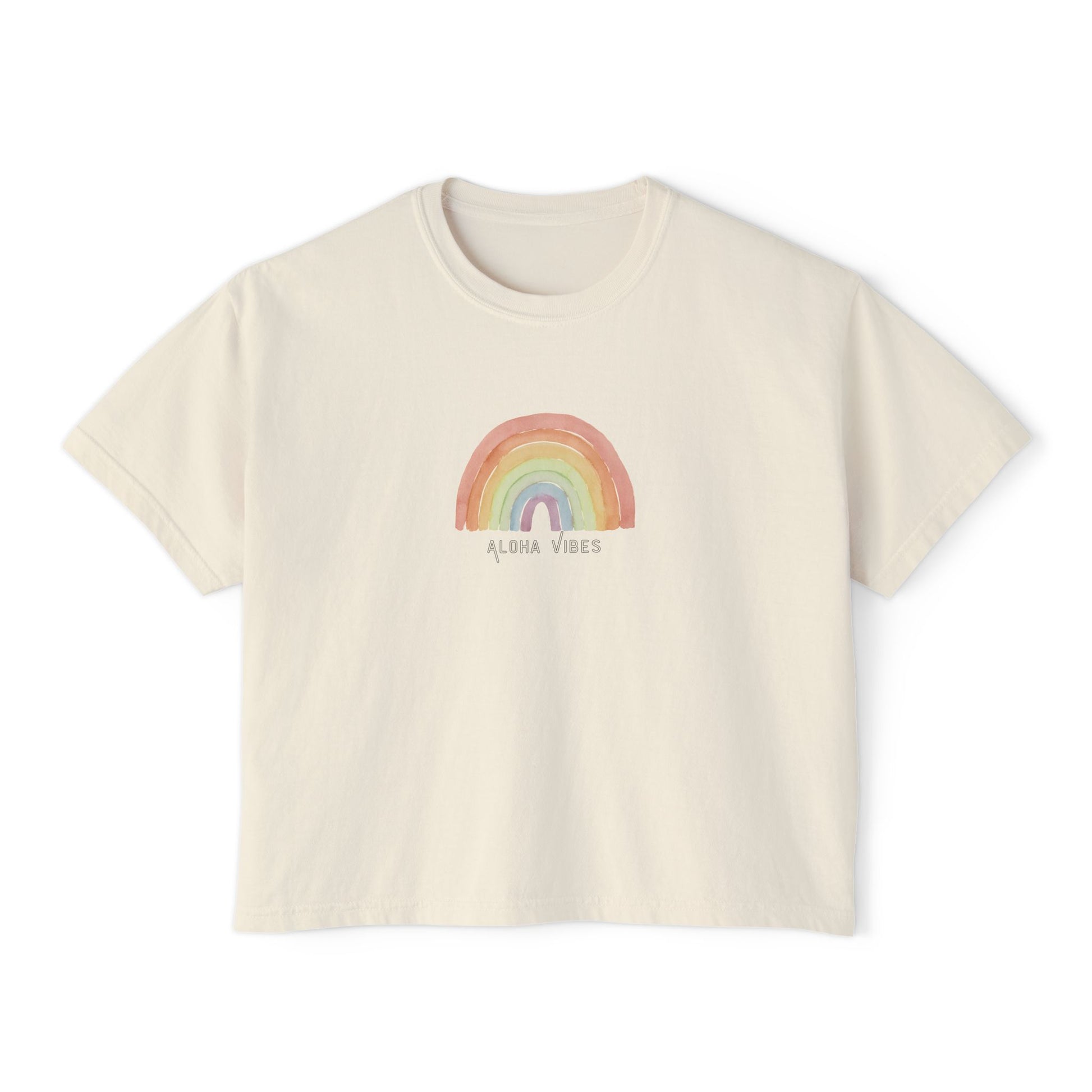 An off-white short-sleeve crop top t-shirt featuring a pastel rainbow graphic on the chest with the text 'ALOHA VIBES' underneath, displayed on a clean white background.