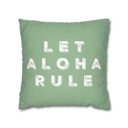 A square mint green throw pillow featuring the phrase 'LET ALOHA RULE' printed in distressed white block letters, shown against a plain white background.