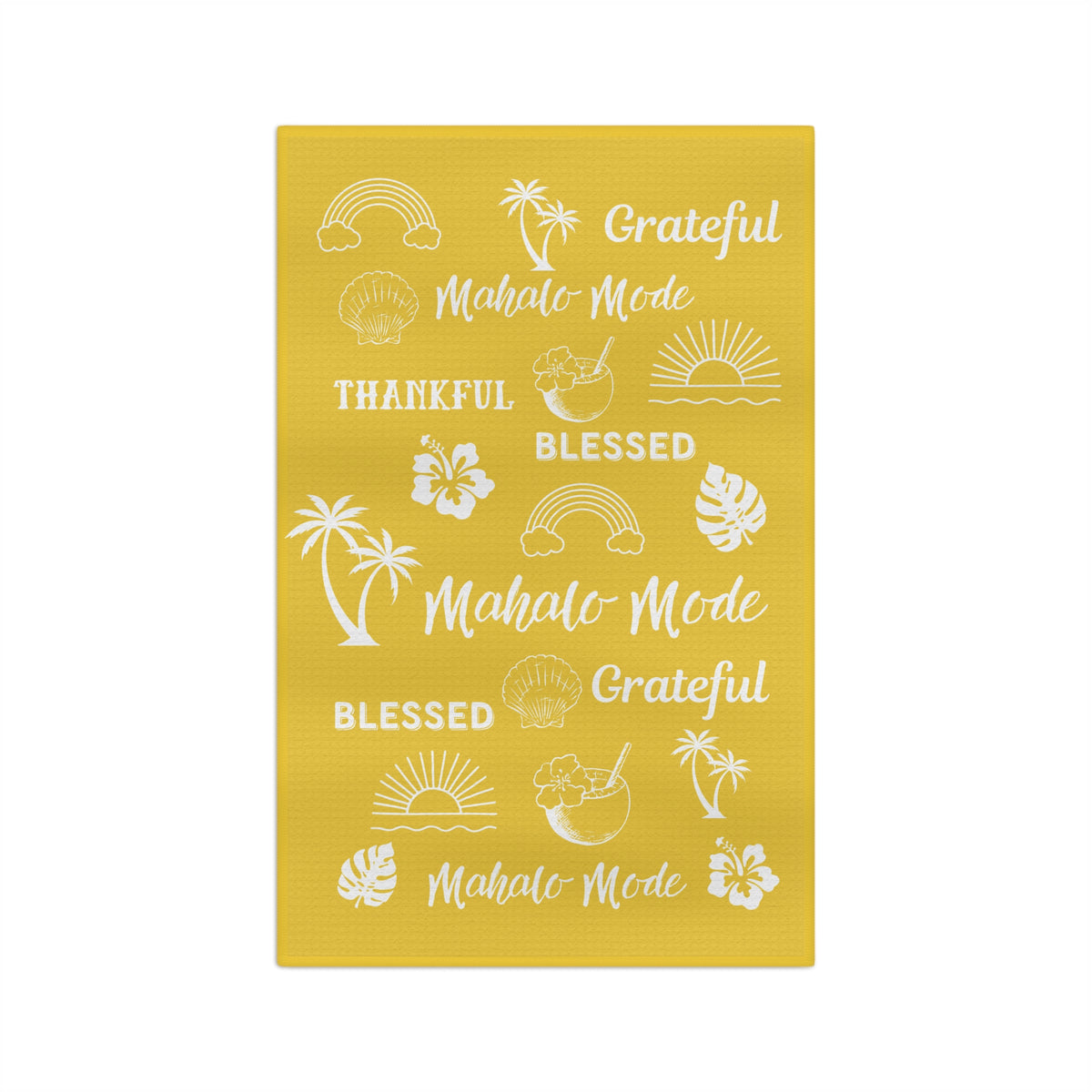 A yellow waffle-weave kitchen towel with white tropical-themed text 'mahalo mode' 'thankful' 'blessed' 'grateful' and illustrations, hanging from a clothesline with wooden clips against a white background.