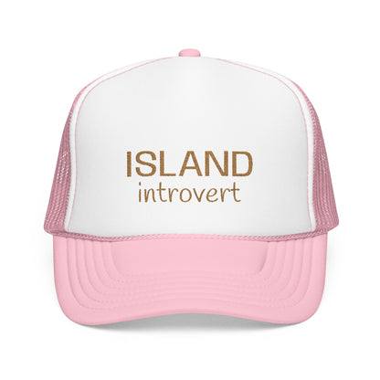 A pink and white trucker hat with the words 'ISLAND introvert' printed in brown on the front panel, shown against a plain white background.