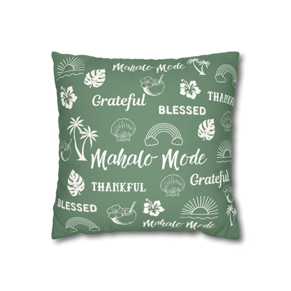 A square sage green throw pillow featuring a white tropical-themed print with words like 'Mahalo Mode', 'Grateful', 'Blessed', and 'Thankful' alongside palm trees, flowers, rainbows, and shells, shown on a plain white background.
