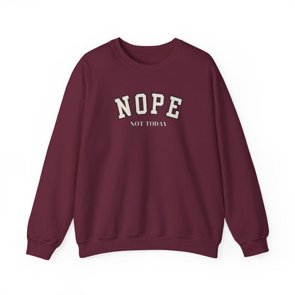 A maroon crewneck sweatshirt with 'NOPE NOT TODAY' printed in cream on the chest, displayed against a plain white background.