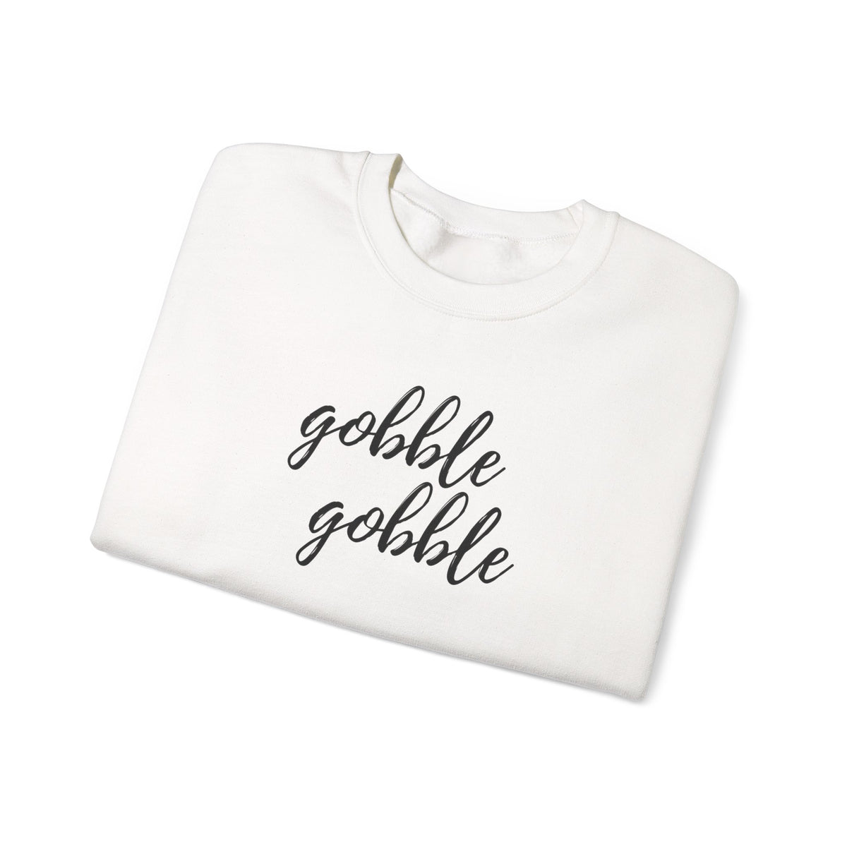 A folded white crewneck sweatshirt with the phrase 'gobble gobble' printed in black cursive script across the front, displayed on a clean white background.