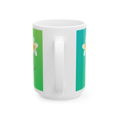 A white ceramic mug with a handle, featuring a wrap-around design with a vertical green stripe on the left and a vertical teal stripe on the right, each printed with a white flower with a yellow center.