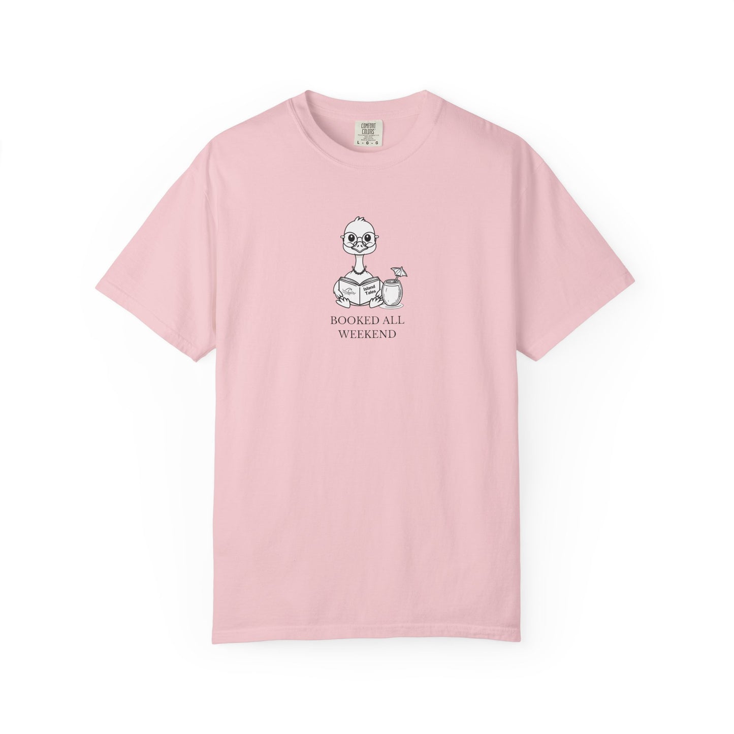 A light pink short-sleeve crewneck t-shirt with a small graphic of a nene goose reading a book and the text 'BOOKED ALL WEEKEND' printed on the chest, displayed on a clean white background.