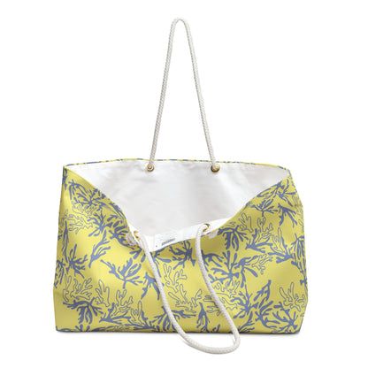A yellow canvas tote bag with a sea coral pattern, featuring a white rope handle and a white inner lining, shown against a plain white background.