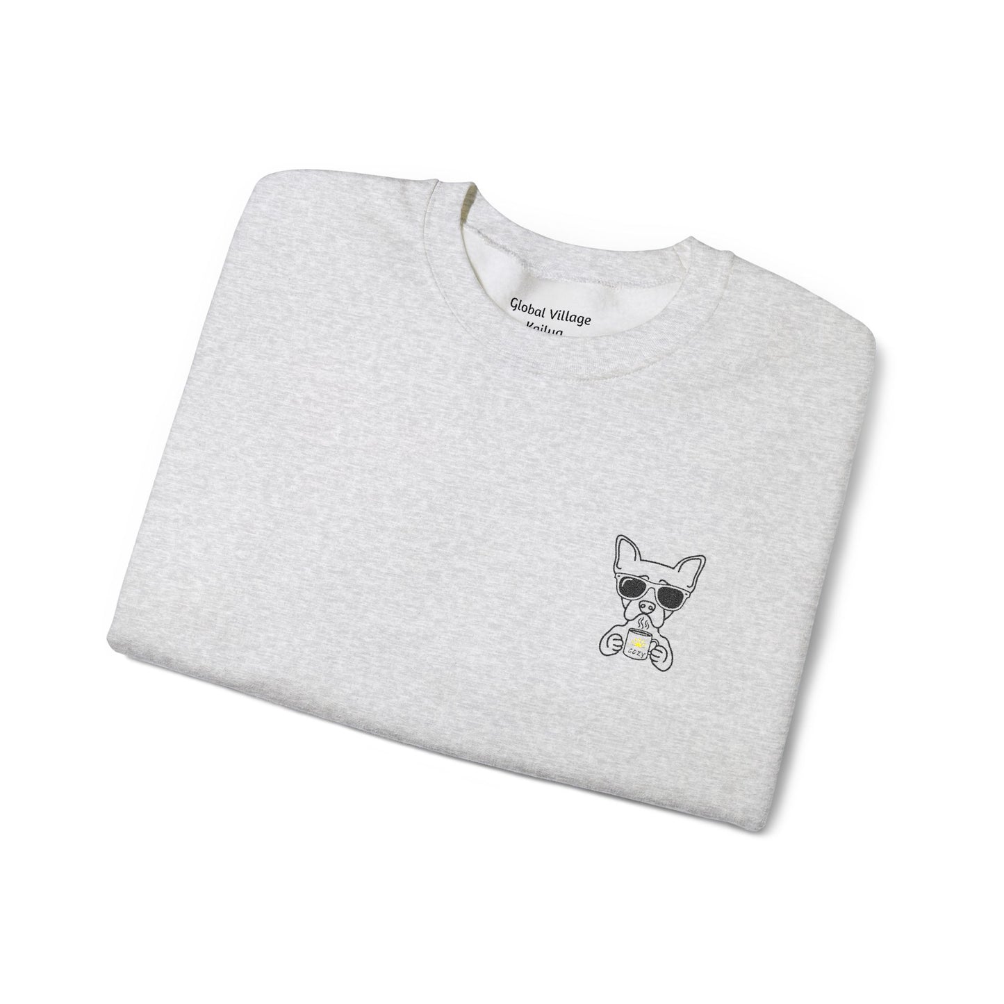 Folded grey sweatshirt with an embroidered dog drinking a cup of coffee on a white background