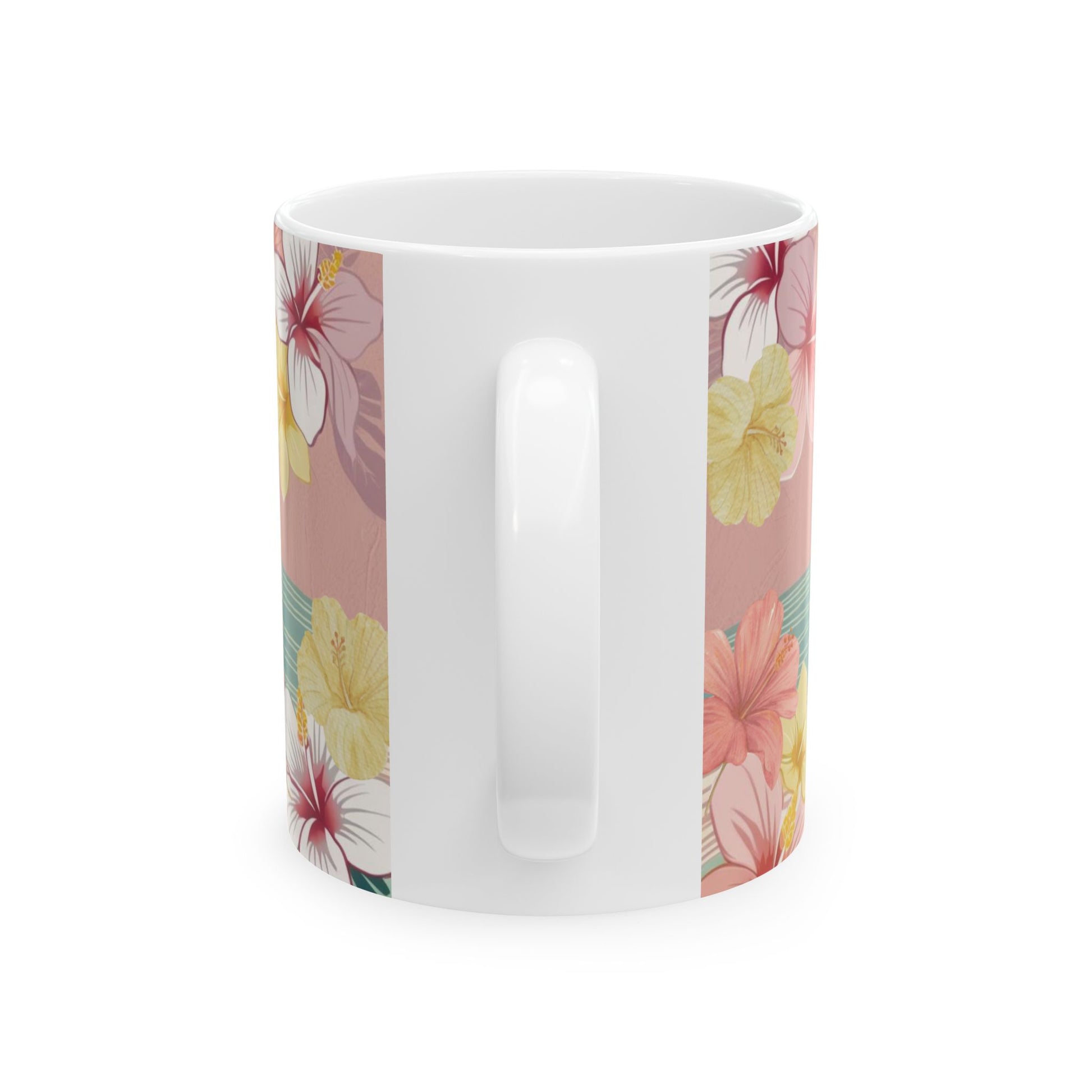 A white ceramic coffee mug featuring a vertical tropical floral print with pink, yellow, and red hibiscus flowers on a dusty pink background.