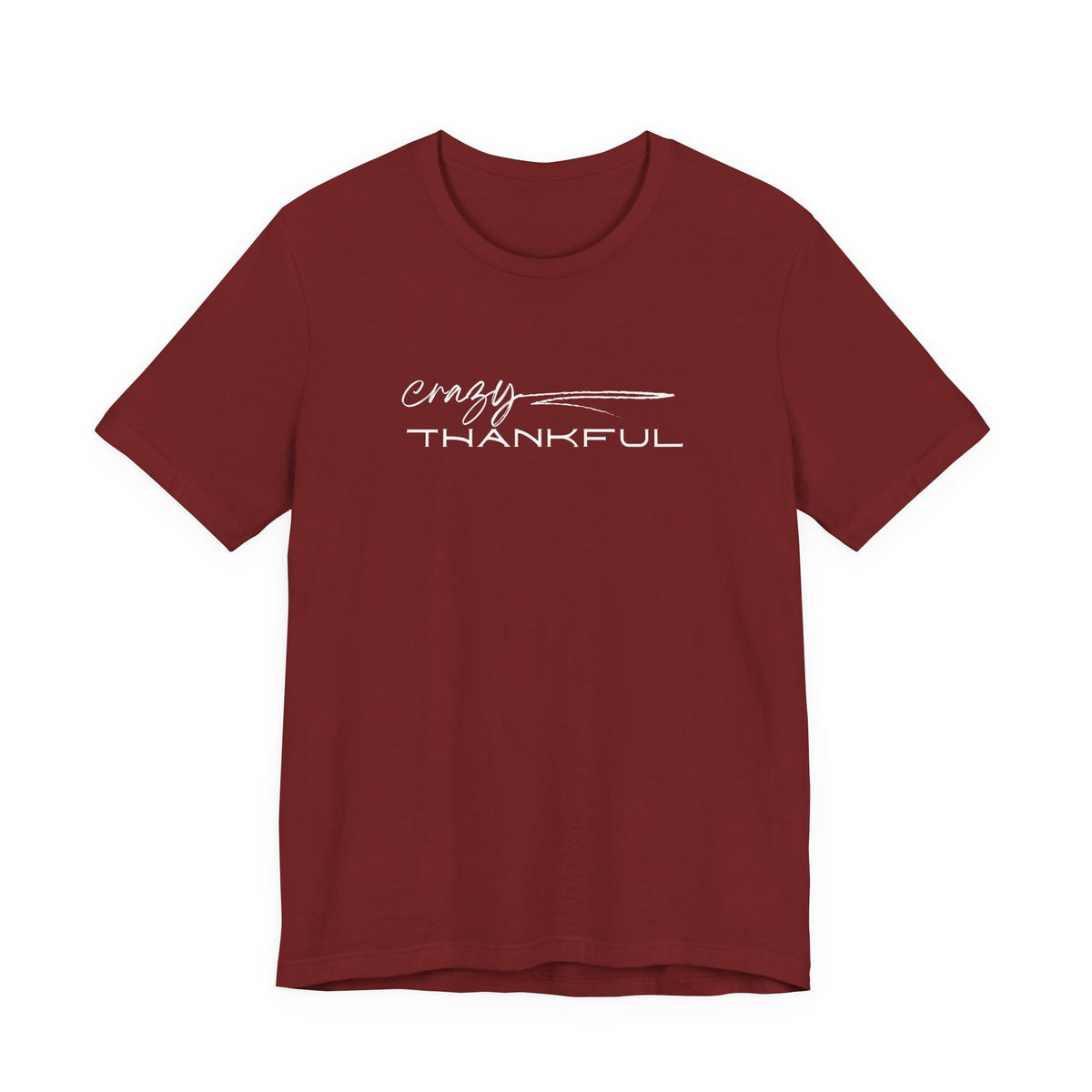 A short-sleeve crewneck t-shirt in maroon red, featuring a white graphic print on the chest that reads 'crazy THANKFUL' with a feather design, shown against a plain white background.