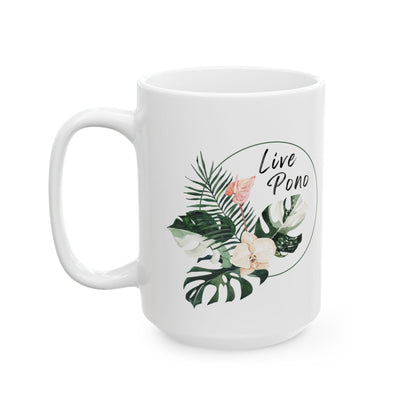 A white ceramic mug featuring a tropical botanical design with green leaves, white flowers, and a pink flower, encircled by the text 'Live Pono' in black script.