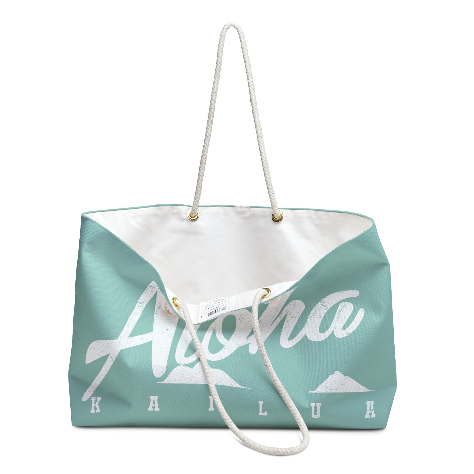 A mint green and white tote bag featuring the word 'Aloha' in white script with mountain graphics and the text 'KAILUA' underneath, complete with white rope handles.