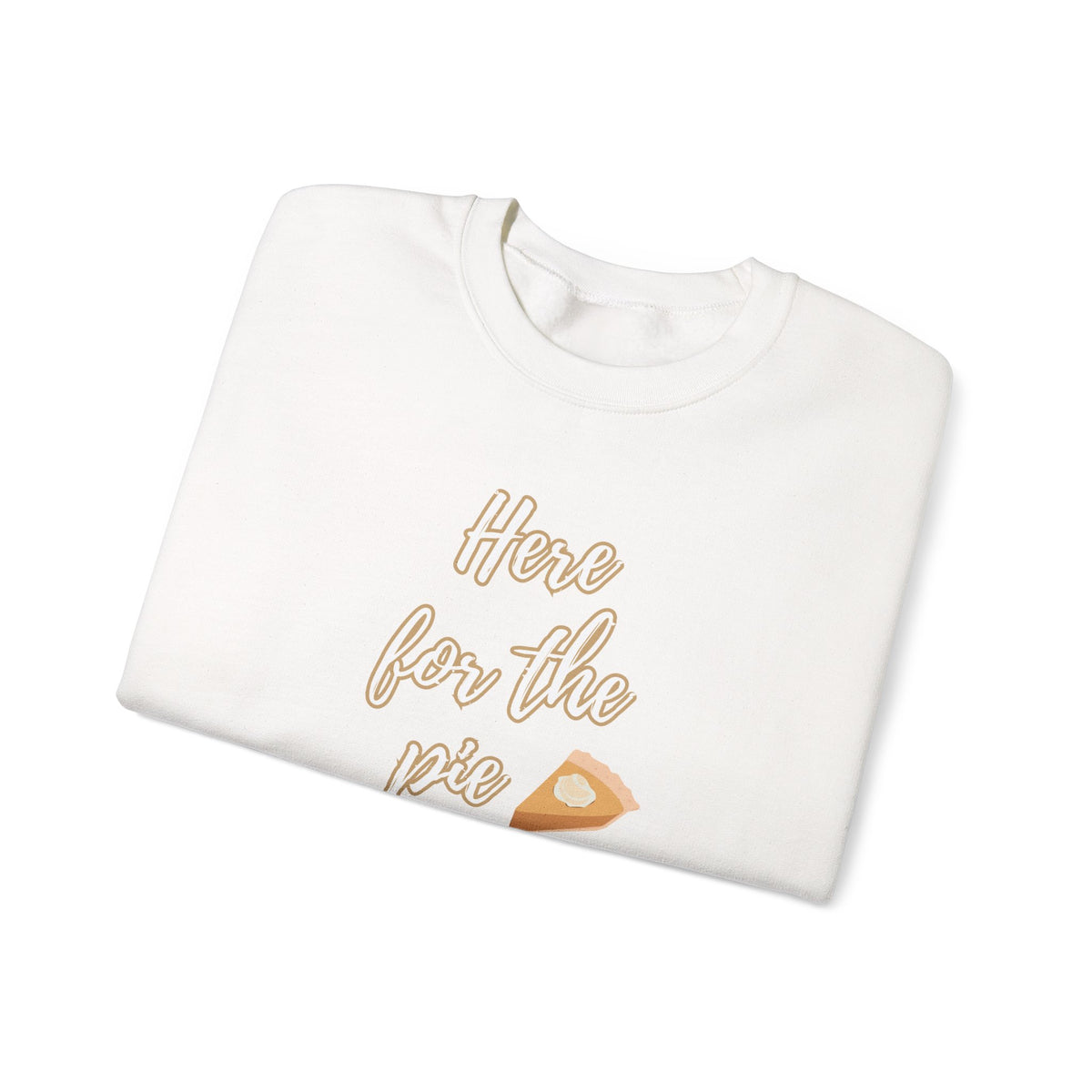 A folded white crewneck sweatshirt featuring a graphic print that reads 'Here for the pie' in a gold cursive font, accompanied by a small slice of pie illustration.