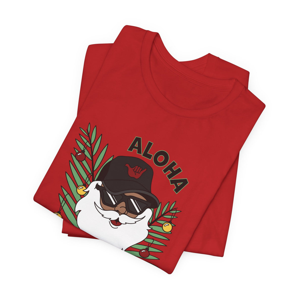 Folded Red Santa Kalikimaka unisex T-shirt with hand-drawn Santa wearing sunglasses and throwing a shaka surrounded by tropical palm leaves.