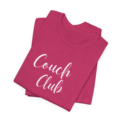 A folded magenta pink t-shirt with 'Couch Club' printed in white script across the front, displayed on a clean white background.