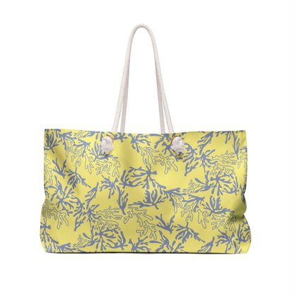 A yellow tote bag with a sea coral pattern and white rope handles, shown against a plain white background.