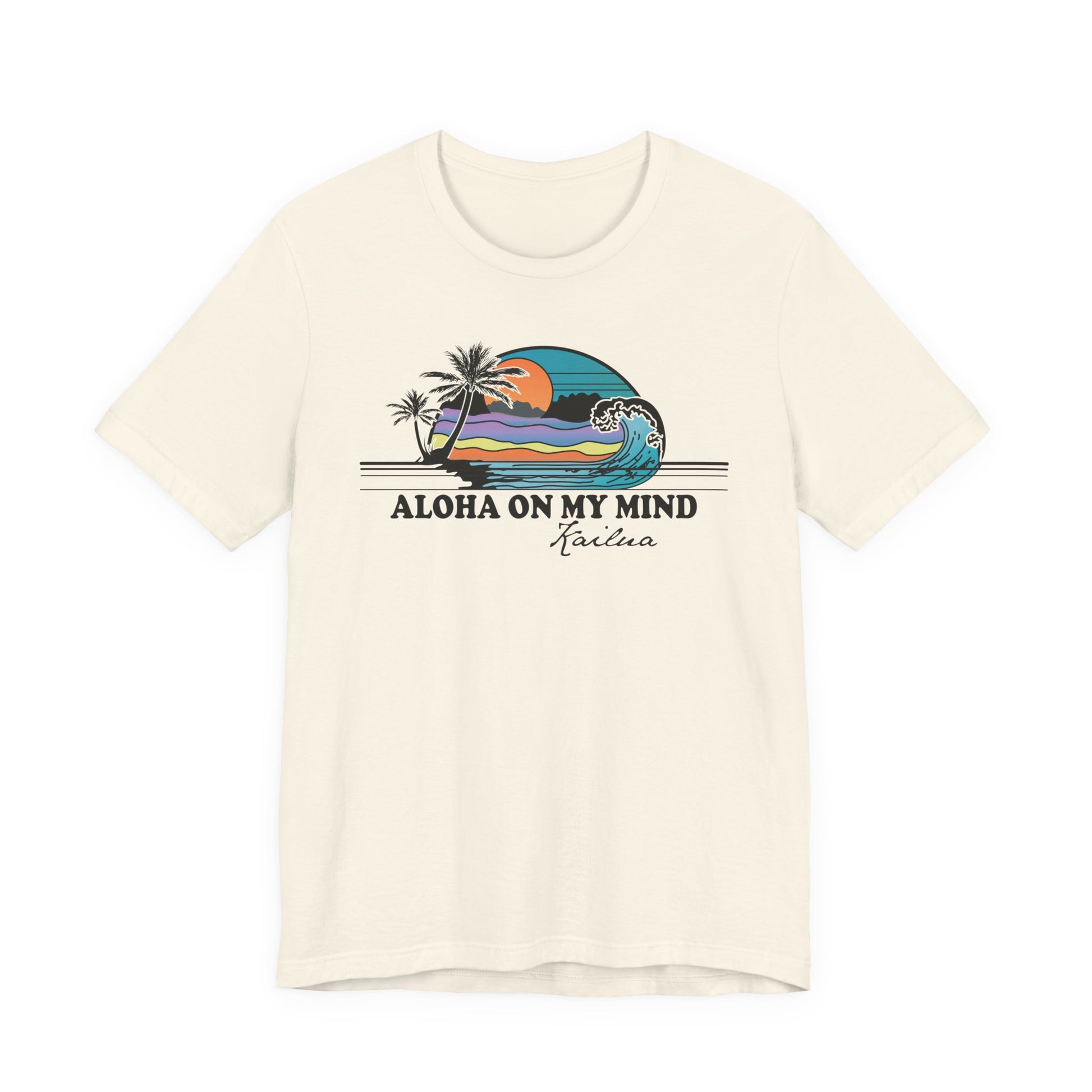 An off-white short-sleeve t-shirt with a retro graphic of a Hawaiian wave and palm trees, featuring the text 'ALOHA ON MY MIND' and 'Kailua' underneath.