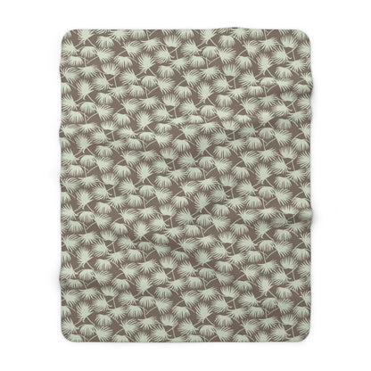 Fan Palm Mocha Mint sherpa fleece blanket with a repeating mint palm leaf pattern on a warm mocha background.