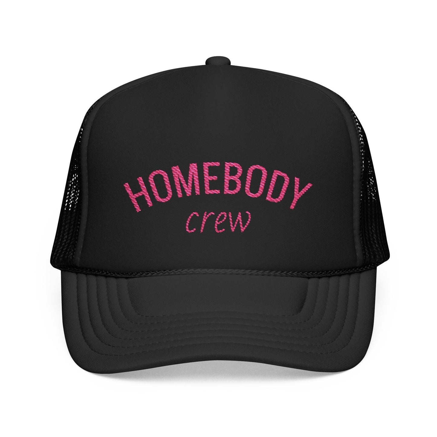 A black trucker-style cap with pink embroidered text reading 'HOMEBODY crew' on the front, shown against a plain white background.