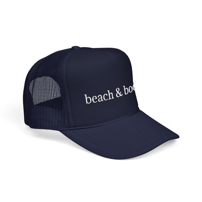 Navy trucker hat with white embroidery 'beach & books'