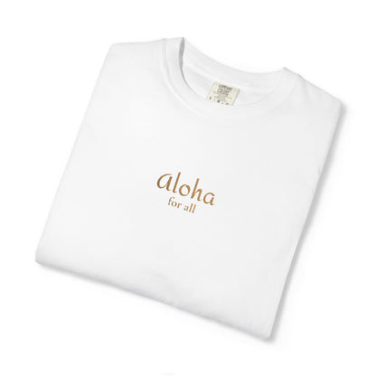 A folded white crewneck t-shirt with 'aloha for all' printed in a metallic gold font on the chest, displayed on a clean white background.
