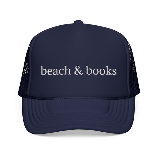 Navy trucker hat with white embroidery 'beach & books'