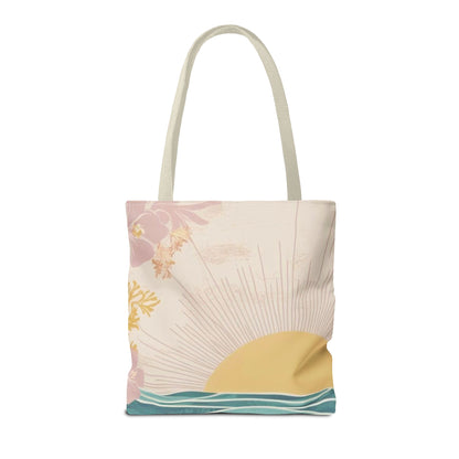A canvas tote bag with a retro sunset and floral design, featuring a cream base with pink, yellow, and teal artwork, and light beige shoulder straps, shown on a plain white background.
