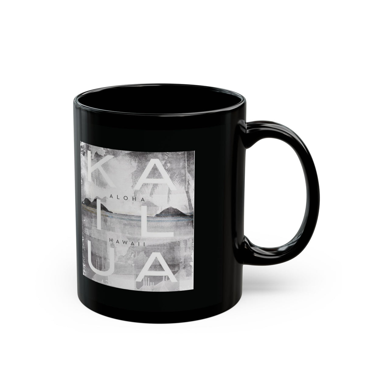 A glossy black ceramic mug featuring a square grayscale graphic print on the front with the words 'KAILUA', 'ALOHA', and 'HAWAII' over a landscape image, shown on a white background.