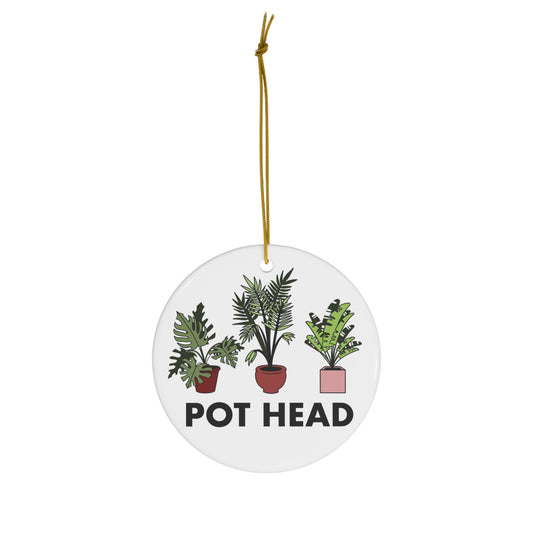 White ceramic Pot Head ornament featuring three illustrated tropical houseplants in colorful pots.
