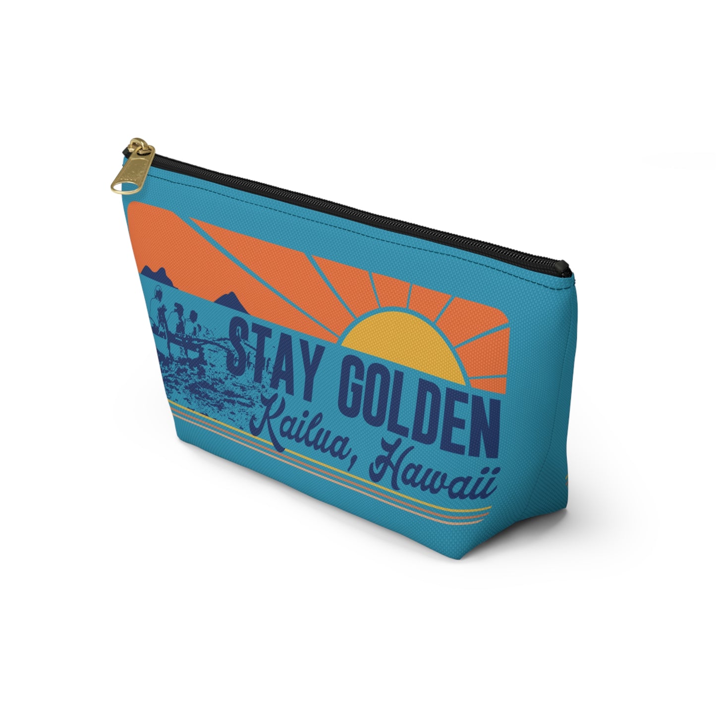 A rectangular zippered pouch with a retro sunset graphic on a turquoise blue background. The design features orange and yellow sun rays, mountains, a rowboat silhouette, and the text 'STAY GOLDEN' and 'Kailua, Hawaii'.