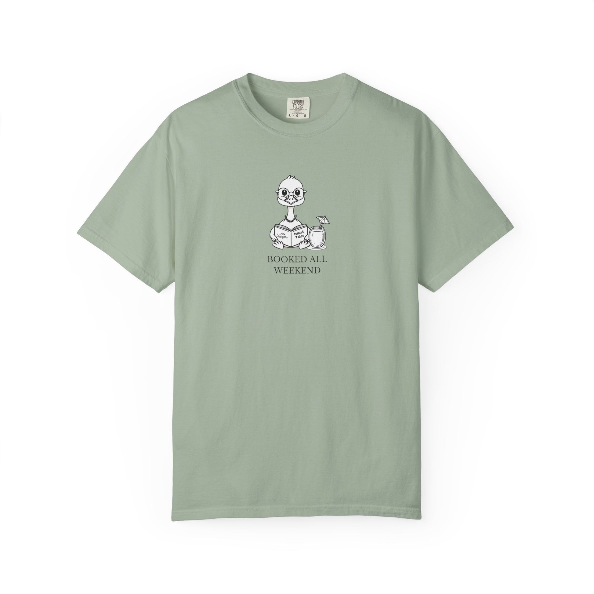 A light green comfort colors t-shirt with design of a nene goose reading a book and text 'booked all weekend' 