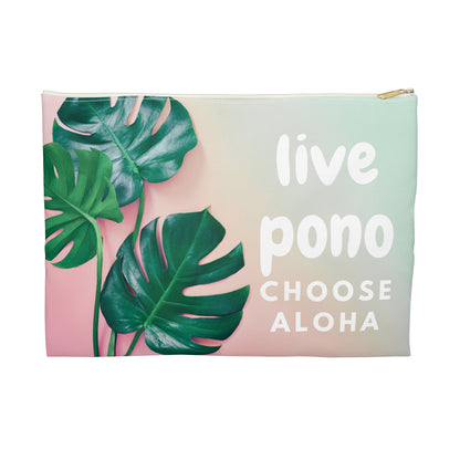 Flat zip pouch featuring a pink and mint monstera design with the words "Live Pono, Choose Aloha" by Global Village Kailua.