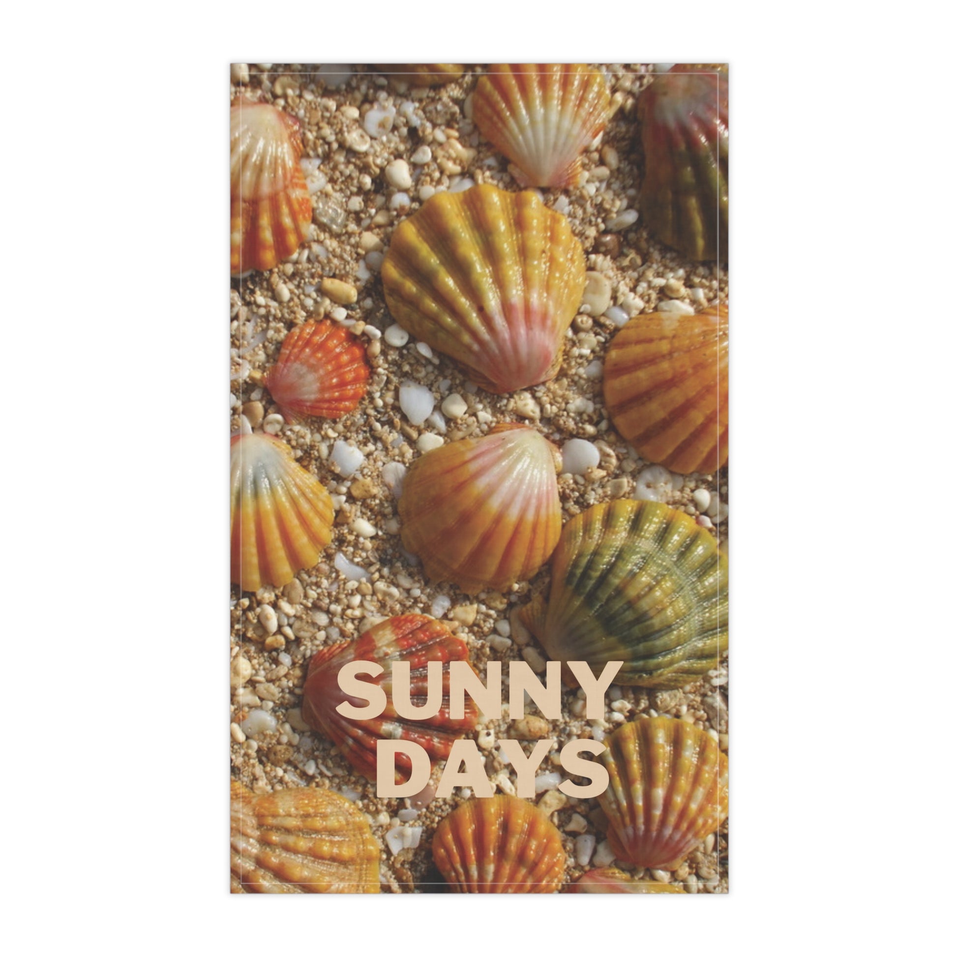 A tea towel featuring a close-up photograph of scallop sunrise shells on sandy ground, with the words “SUNNY DAYS” printed across the lower center. The design is centered on a white background.