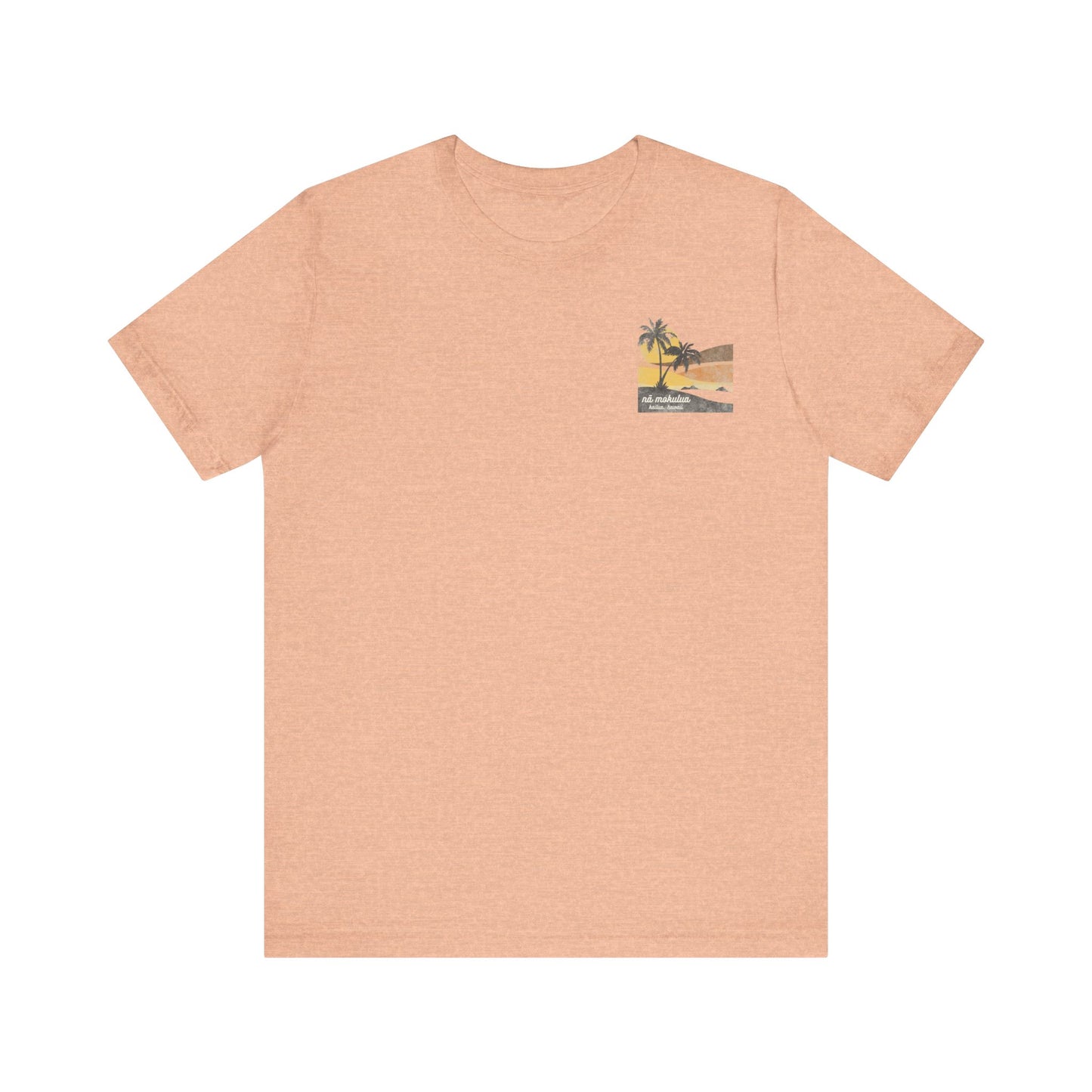 A heather peach short-sleeve t-shirt with a vintage-style graphic on the front left chest depicting two palm trees against a yellow and orange sunset, with the text 'ná makulua' and 'Kailua, Hawaii!' printed below.