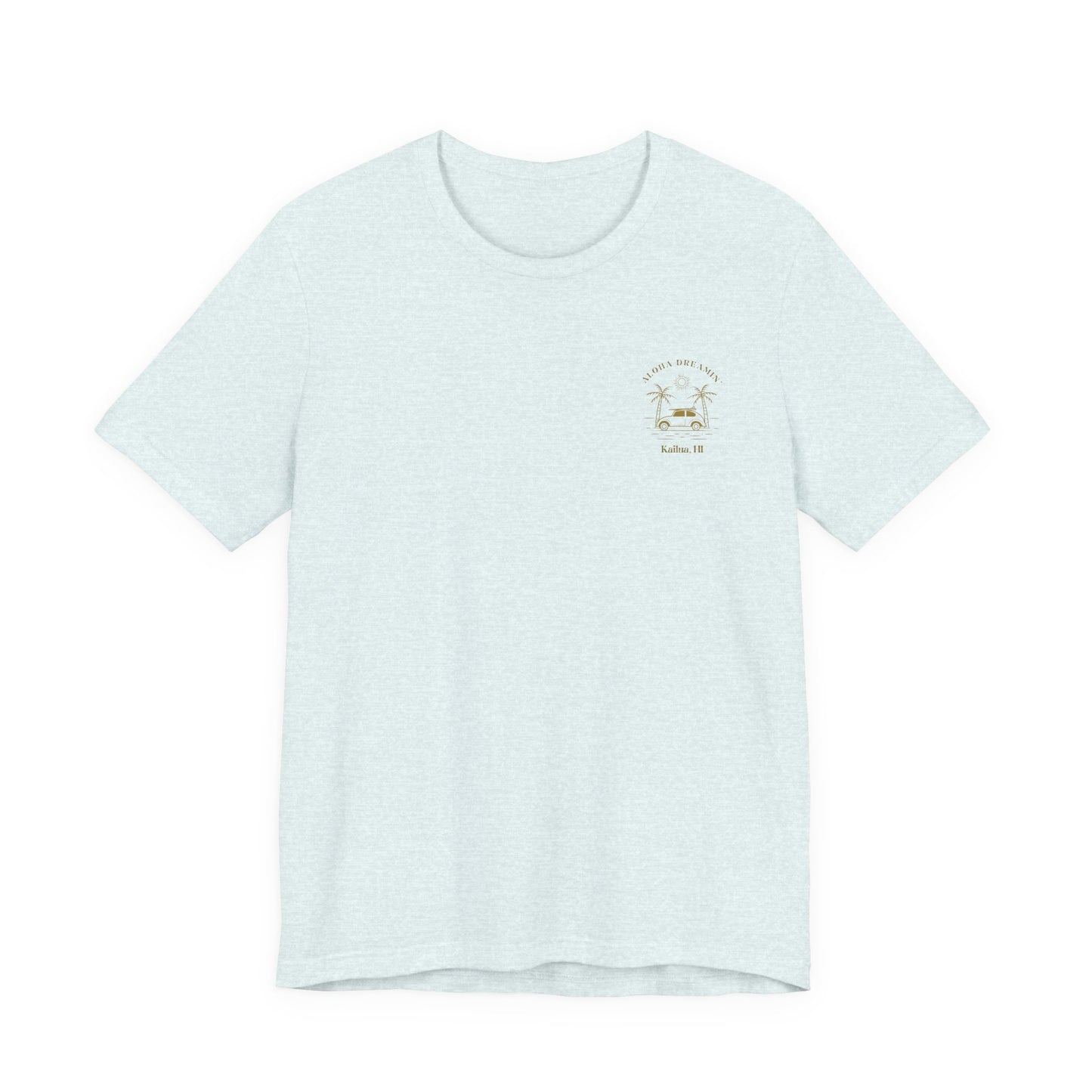 A light blue short-sleeve t-shirt shown from the front, featuring a gold-colored retro graphic of a classic car between two palm trees with the text 'ALOHA DREAMIN'' and 'Kailua, HI' on the left chest.