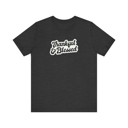 A black short-sleeve t-shirt with a white graphic text print reading 'Thankful & Blessed' on the chest, displayed against a solid white background.