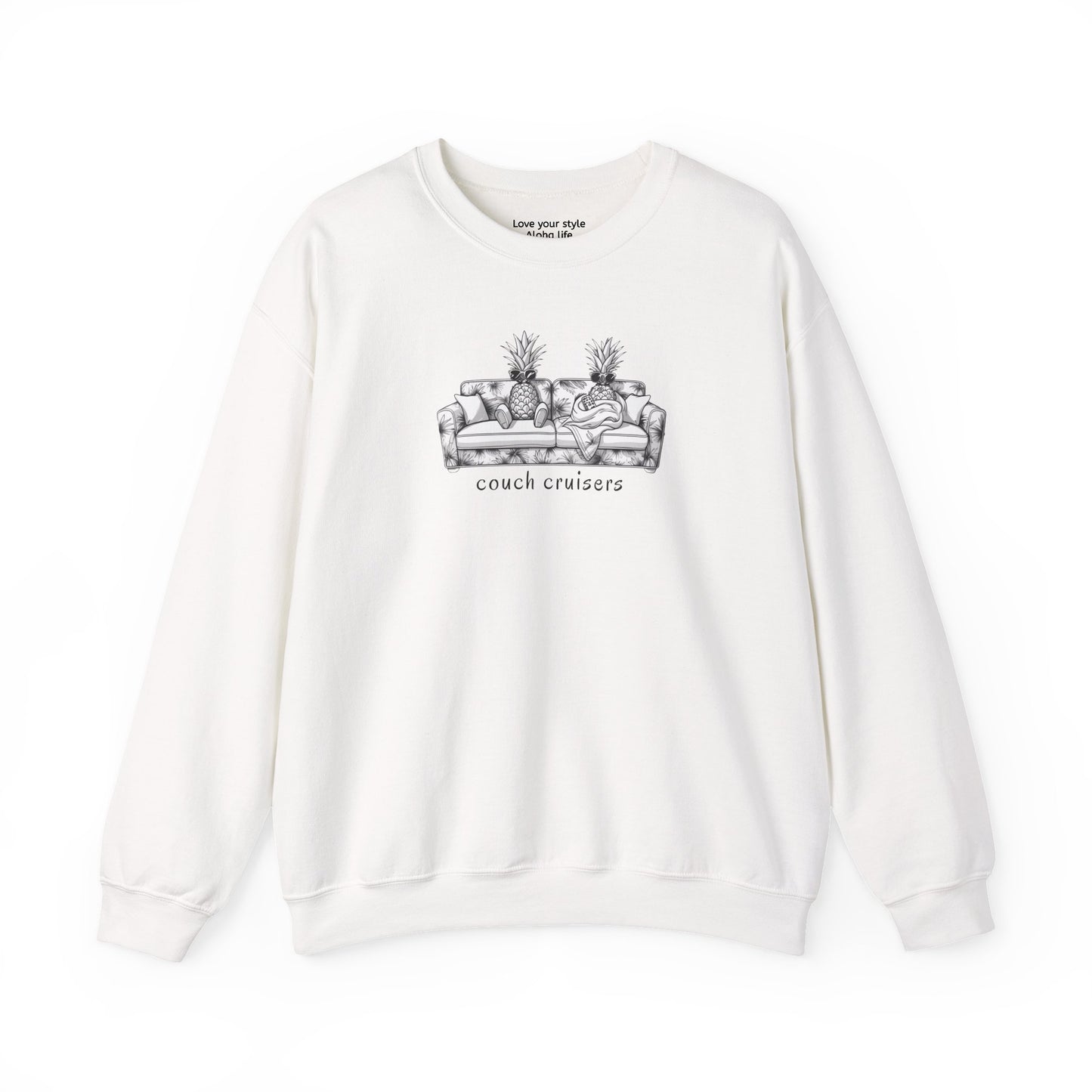 An white crewneck sweatshirt featuring a black line art graphic of a couch with two pineapples and the text 'couch cruisers' printed on the chest.