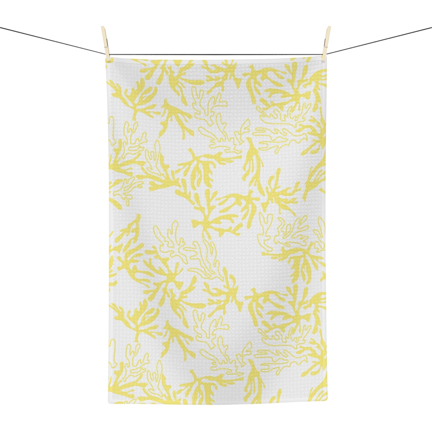 Microfiber kitchen towel featuring the original Global Village Kailua Coral Sunshine pattern in soft yellow and white, adding a bright island-inspired touch to any kitchen.
