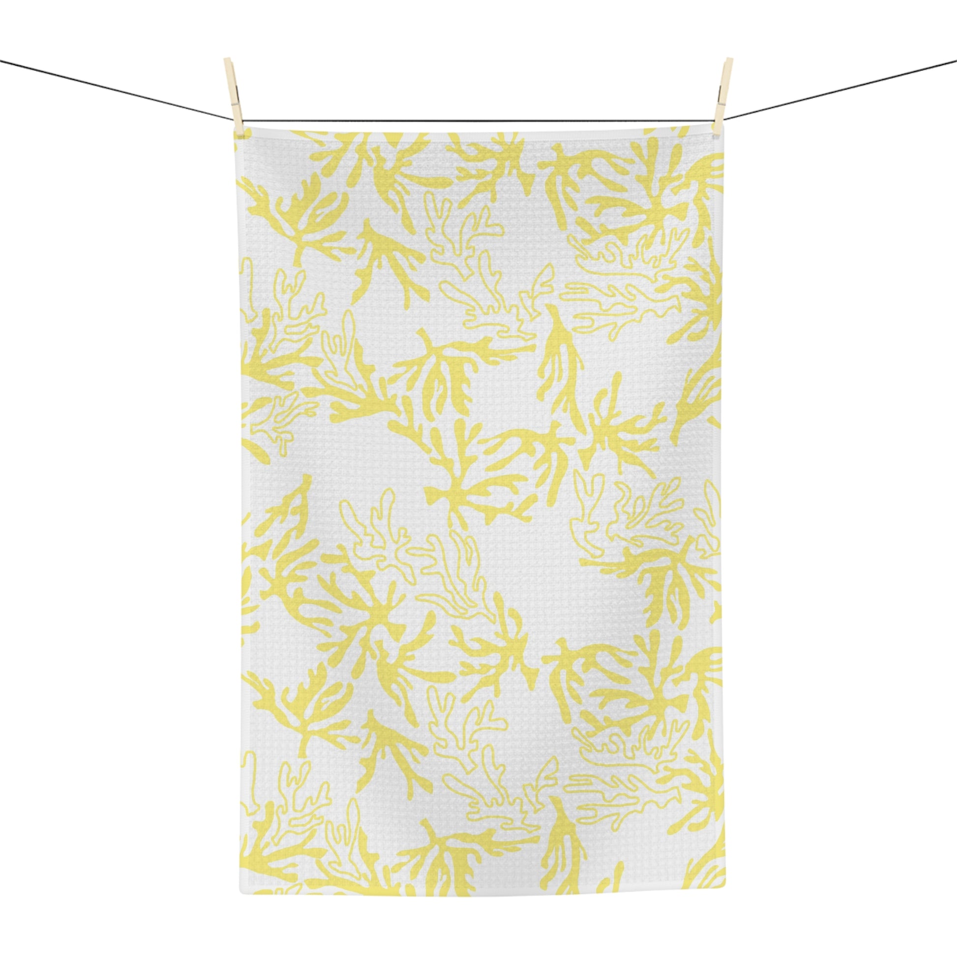 Microfiber kitchen towel featuring the original Global Village Kailua Coral Sunshine pattern in soft yellow and white, adding a bright island-inspired touch to any kitchen.