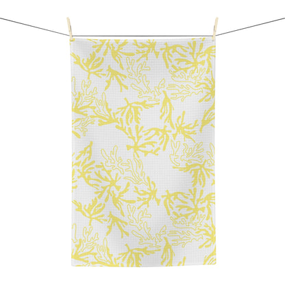 Microfiber kitchen towel featuring the original Global Village Kailua Coral Sunshine pattern in soft yellow and white, adding a bright island-inspired touch to any kitchen.