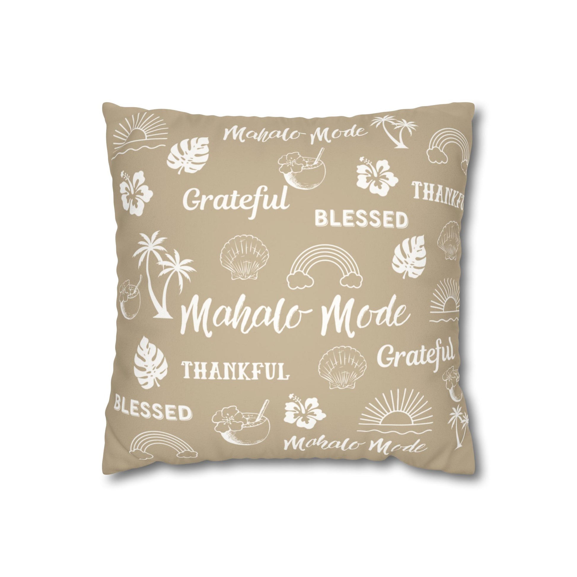 A square throw pillow in a warm beige color, printed with white tropical-themed illustrations and words including 'Mahalo Mode', 'Grateful', 'Blessed', and 'Thankful'.