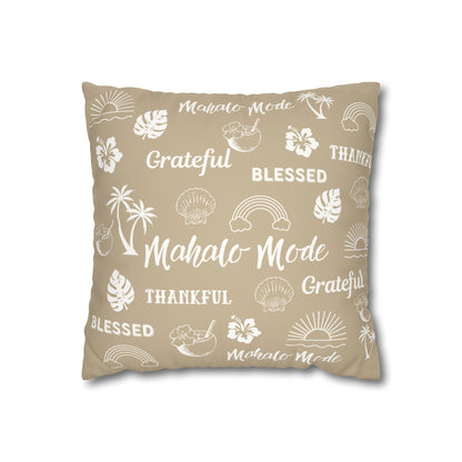 A square throw pillow in a warm beige color, printed with white tropical-themed illustrations and words including 'Mahalo Mode', 'Grateful', 'Blessed', and 'Thankful'.