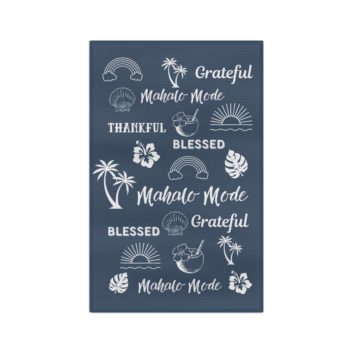 A denim blue kitchen towel with white tropical-themed illustrations and phrases including 'Grateful Mahalo Mode,' 'THANKFUL,' 'BLESSED,' and repeated 'Mahalo Mode' text, shown on a plain white background.